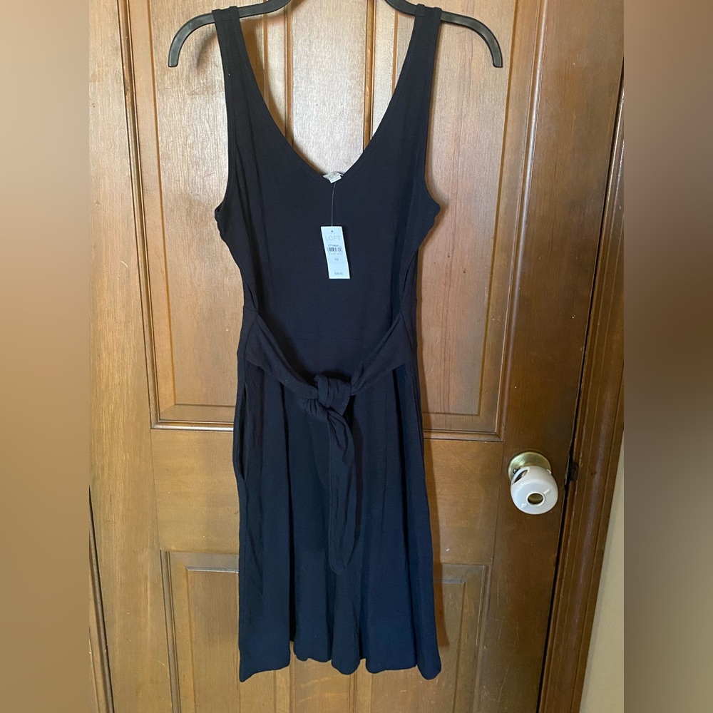 Never worn with tags. Loft Black dress with front tie. Size XS